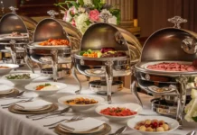 A luxurious buffet setup featuring polished stainless steel chafing dishes