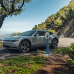 Portable Electric Car Battery Charger: Reliable Charging On-the-Go scenic mountain road with a portable electric car charger connected