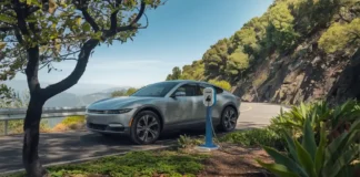 Portable Electric Car Battery Charger: Reliable Charging On-the-Go scenic mountain road with a portable electric car charger connected