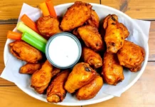 A plate of crispy, golden-brown chicken wings Chicken Wings Recipe