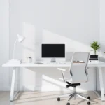 Minimalist Office Organization: Simple & Smart Workspaces A sleek, Minimalist Office Organization with a clean white desk, ergonomic chair, neatly arranged workspace essentials, soft lighting, and a touch of greenery.