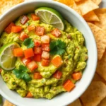 Guacamole Recipe: Easy, Fresh & Flavorful Dip A top-down view of a bowl of freshly made Guacamole Recipe