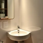 10 Best Corner Small Bathroom Sink for Space-Saving Style A modern Corner Small Bathroom Sinks with soft lighting, and stylish decor