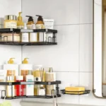 A modern bathroom with sleek shower corner shelf holding neatly arranged toiletries