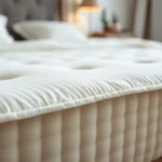 Natural Latex Mattresses: Benefits, Reviews & Buying Guide Close-up shot of a luxurious natural latex mattress with organic cotton cover and soft texture