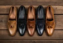 A stylish flat lay of various men's and women's loafers in leather and suede, placed on a wooden surface with soft shadows