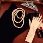 A stylish flat lay of Audrey Hepburn fancy dress essentials