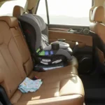 modern car interior with a sleek black Britax Boulevard ClickTight Convertible Car Seat securely installed in the backseat,