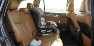 modern car interior with a sleek black Britax Boulevard ClickTight Convertible Car Seat securely installed in the backseat,