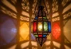 Moroccan Style Hanging Lanterns for Elegant Homes A luxurious Moroccan-style hanging lantern glowing warmly in a cozy living room