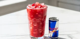 red bull fruit smoothie made with fresh berries and ice in a clear glass