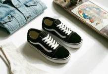 Vans Old Skool Shoes: 7 Reasons They Never Go Out of Style Black Vans Old Skool shoes styled with denim and skateboard accessories on white background