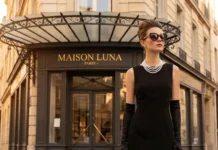 Elegant -inspired Audrey Hepburn looks look with black dress, pearls, gloves, and oversized sunglasses.