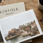 Kinfolk travel guide featuring a stylish traveler exploring a peaceful countryside with minimalist slow travel elegance.