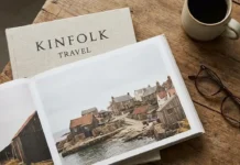 Kinfolk travel guide featuring a stylish traveler exploring a peaceful countryside with minimalist slow travel elegance.
