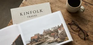 Kinfolk travel guide featuring a stylish traveler exploring a peaceful countryside with minimalist slow travel elegance.