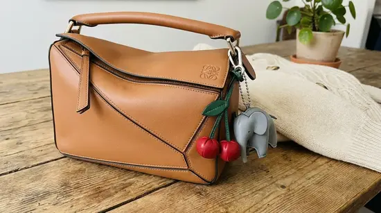 Loewe Puzzle Luxury Bag Charms bag personalized with cherry and elephant