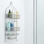 Modern hanging shower caddy with toiletries in a clean white bathroom