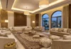 Modern Majlis Seating Ideas for Elegant Arabic Homes Modern majlis seating with elegant Arabic floor seating, luxury sofas, neutral cushions, and contemporary Middle Eastern interior design.