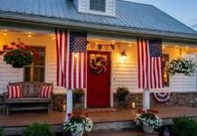 Patriotic front porch makeover with red white and blue decorations, American flags, wreath, and rustic seating