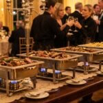 Burners for Chafing Dishes: Best Guide for Food Warming Professional stainless steel chafing dishes with burners keeping buffet food warm at a catering event