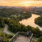 Scenic view of Knox County Tennessee with rolling hills, river, and Knoxville skyline at sunset