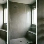 Tension Pole Shower Caddy: Smart Bathroom Storage Stainless steel tension pole shower caddy organizing bathroom essentials in a modern minimalist shower space.