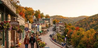 Historic downtown Eureka Springs in the Ozark Mountains featuring Victorian buildings, colorful fall foliage, and scenic hillside streets for an unforgettable Ozarks getaway.