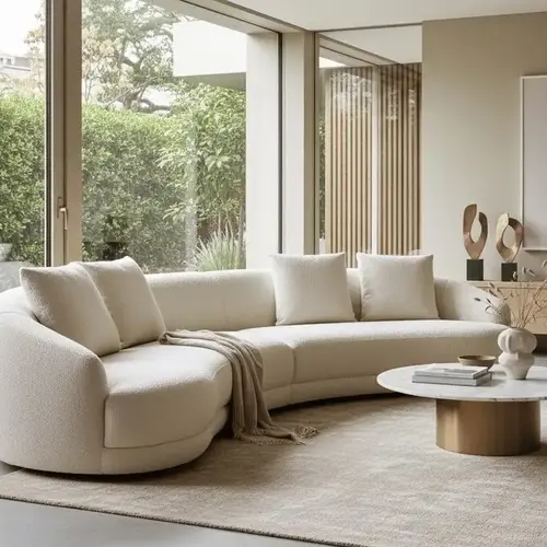 Curved sofa in a warm neutral fabric