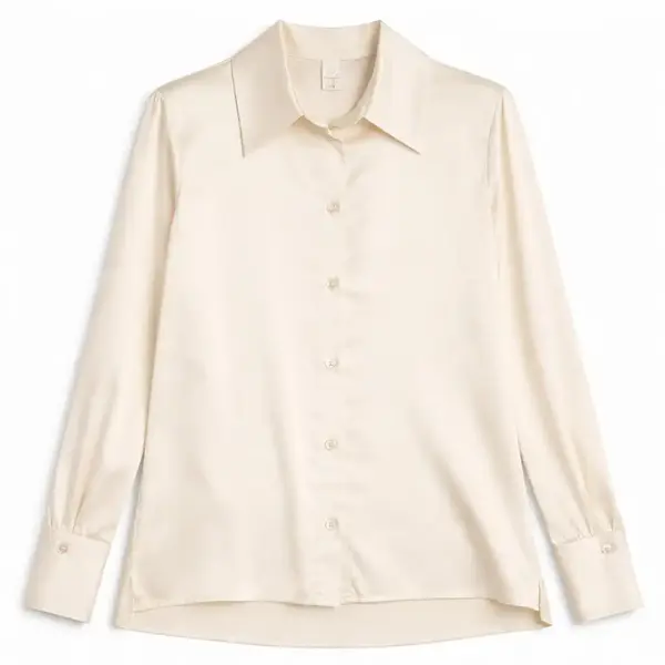 Cream silk or silk-blend blouse with a refined look for elegant winter workwear and evening outfits.