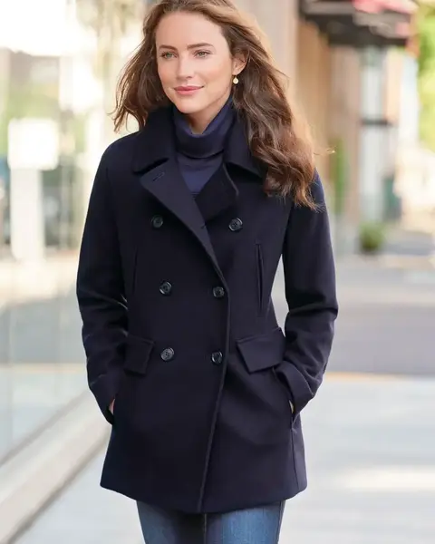 Navy wool peacoat with a structured double-breasted design for a timeless winter outfit.